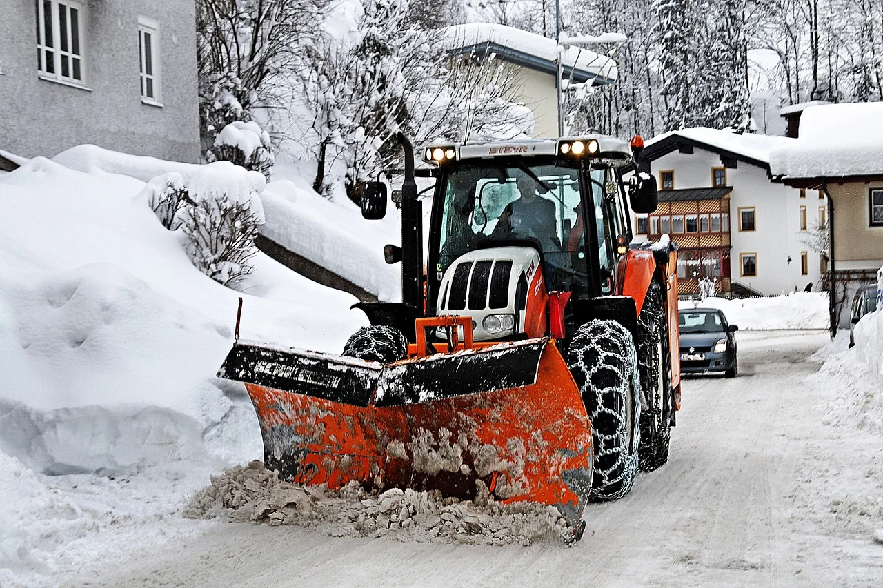 Snow plow on the road