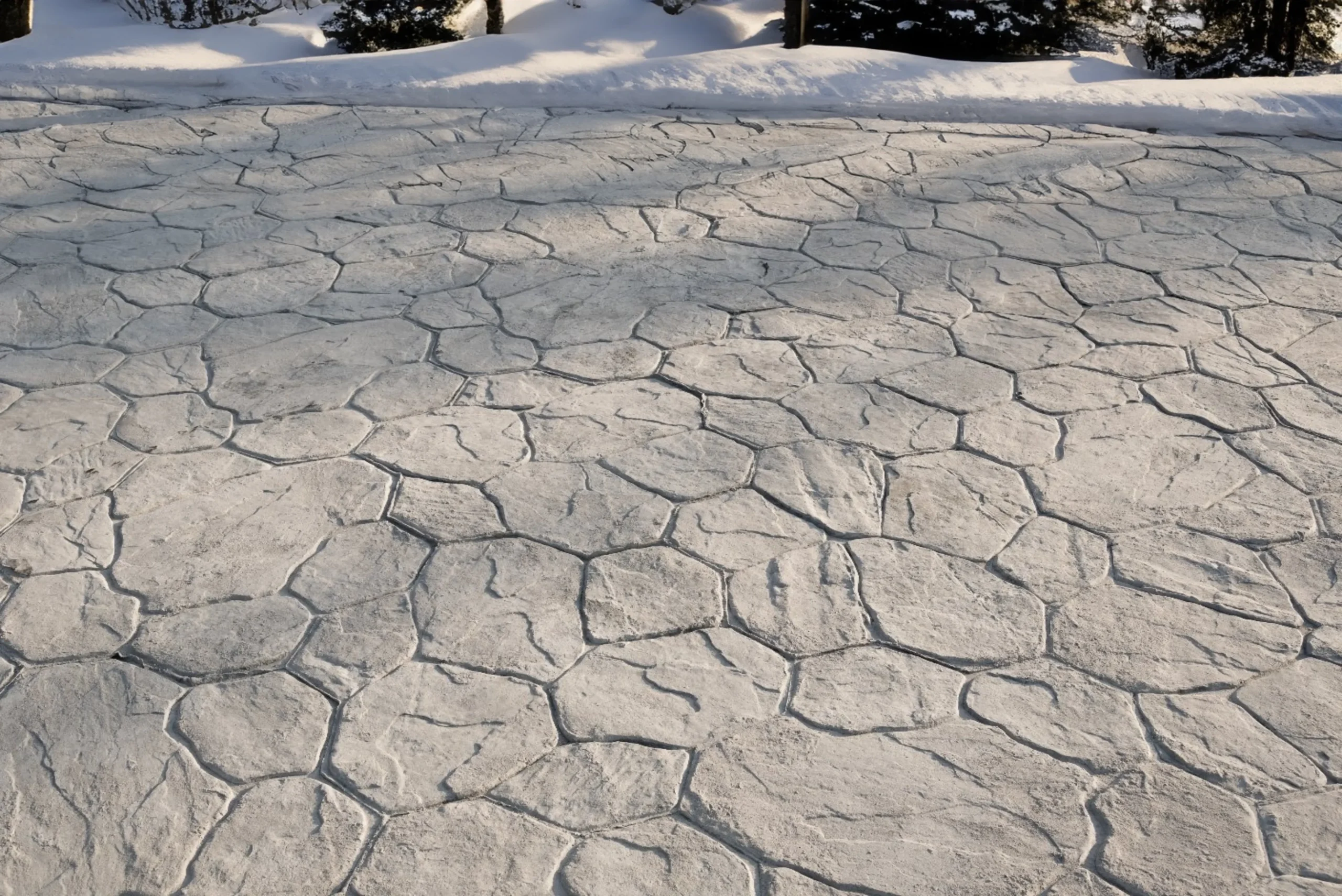 Light grey stamped concrete heated driveway