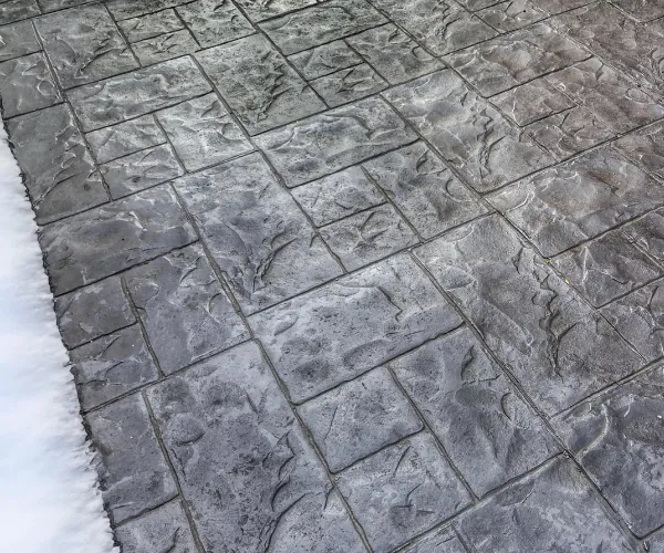 Heated driveway with stamped concrete finishing